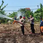 Hadapi Kemarau, Polres Pelabuhan Tanjungperak Siram Lahan Jagung Ketahanan Pangan
